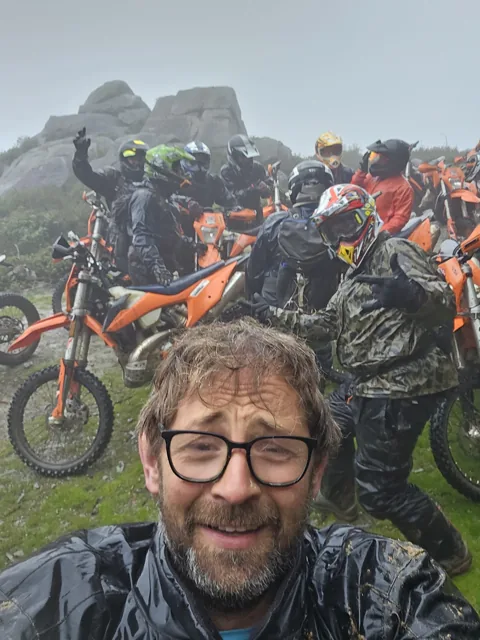 A group selfie in the misty hills