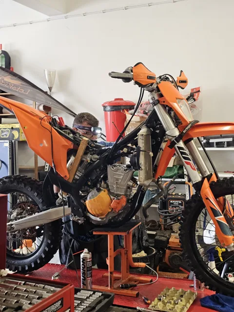 A KTM on the workshop stand