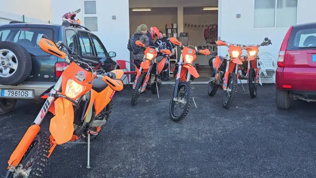 Riders preparing their KTMs at the base