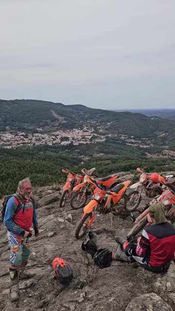 Riders at a rocky mountain viewpoint