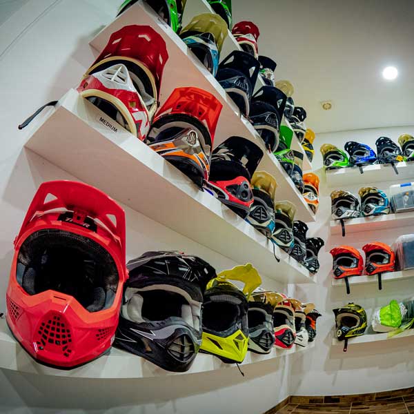 Riding helmets arranged in the equipment room at the Let’s Ride Portugal base