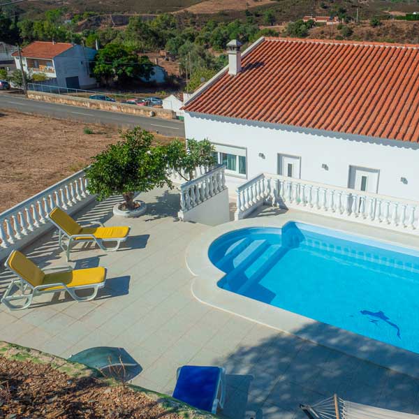 Pool, sun loungers and guest house at the enduro base in Rasmalho