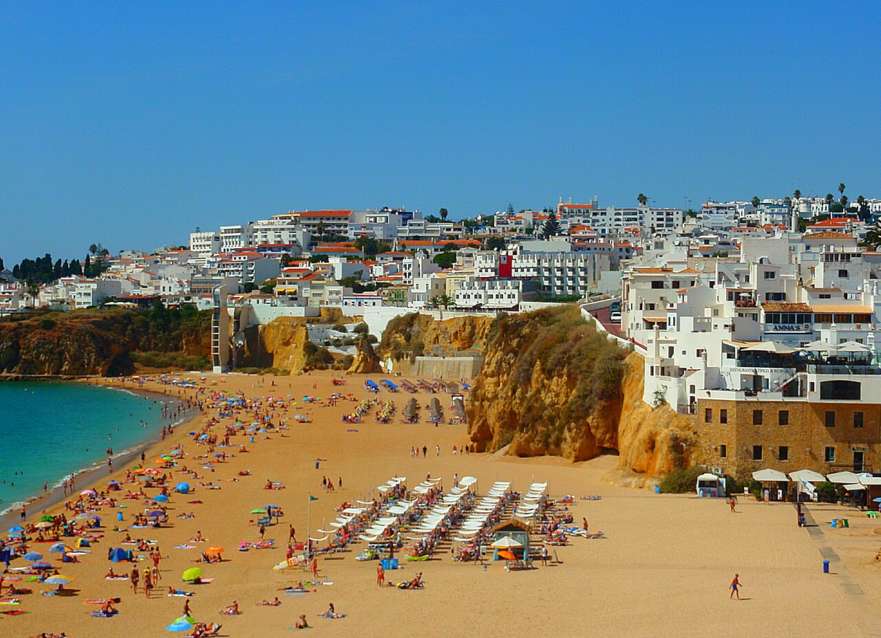 White houses above the cliffs and beach in central Albufeira.