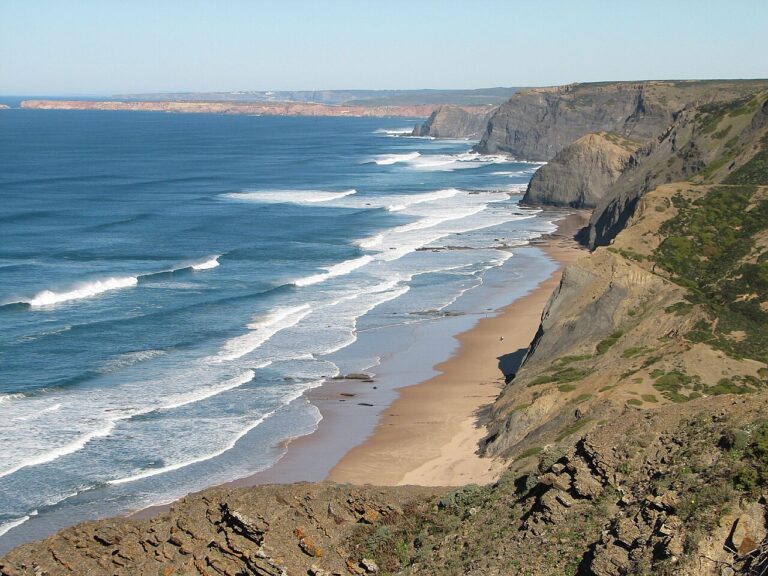 Praia da Cordoama, Algarve. Big cliffs. Long lines of surf.