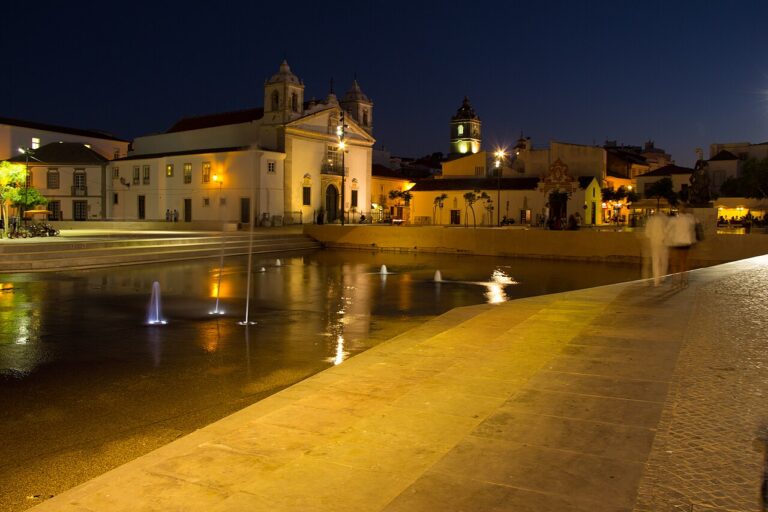 Praça Infante Dom Henrique and Santa Maria church illuminated at night in Lagos