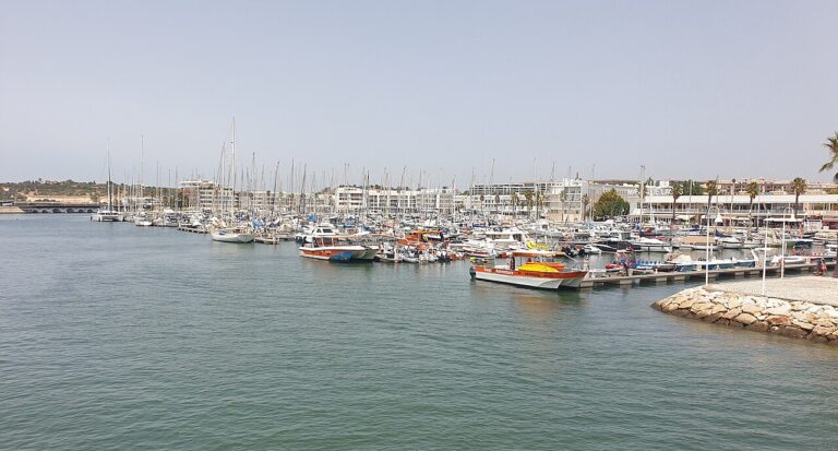 Sailing boats and waterfront buildings at Marina de Lagos, Algarve.