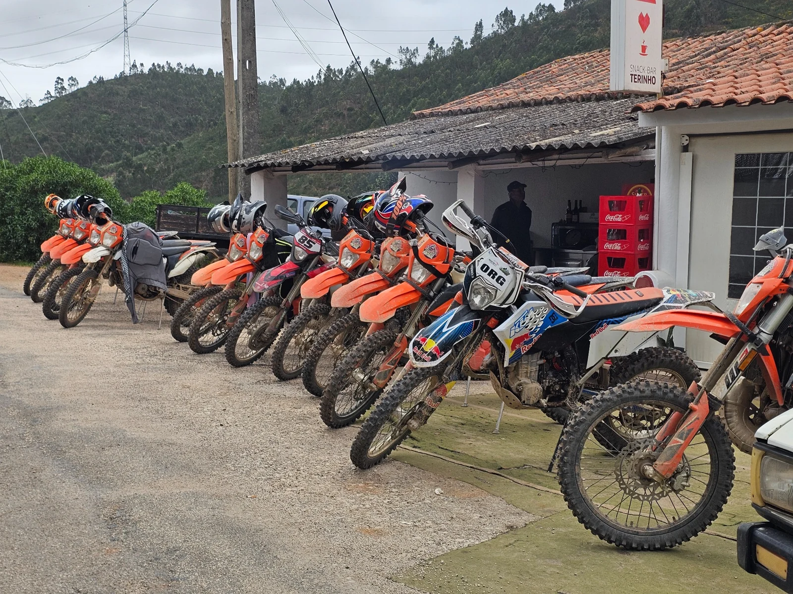 Enduro motorcycles parked outside Pára e Fica near Silves