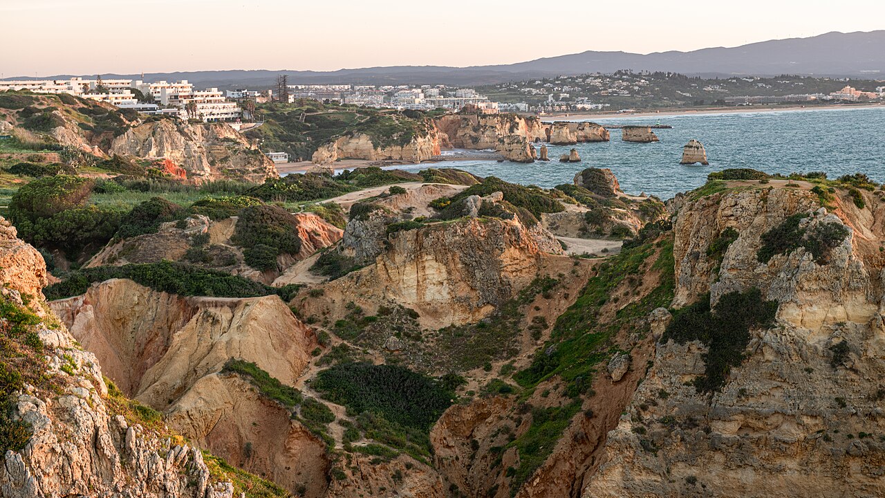 Golden limestone sea stacks and clear water at Ponta da Piedade in Lagos