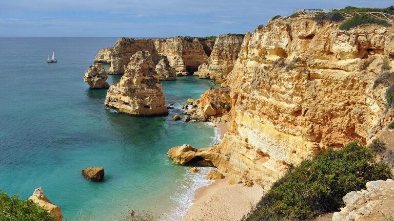 Praia da Marinha, Algarve. Golden rock and clear coastal views.