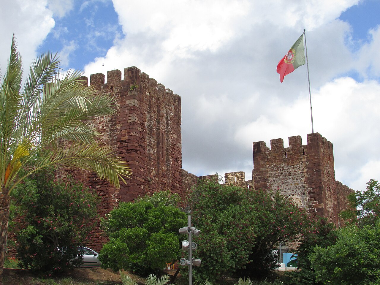 Red sandstone towers and walls of Silves Castle.