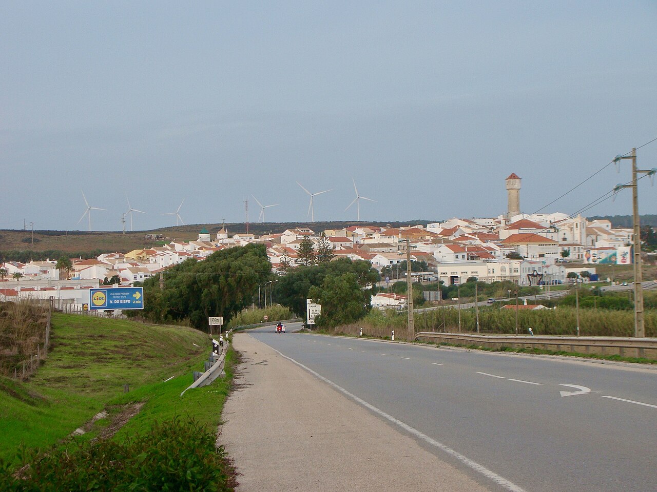 Vila do Bispo and its church tower viewed from the approach road.
