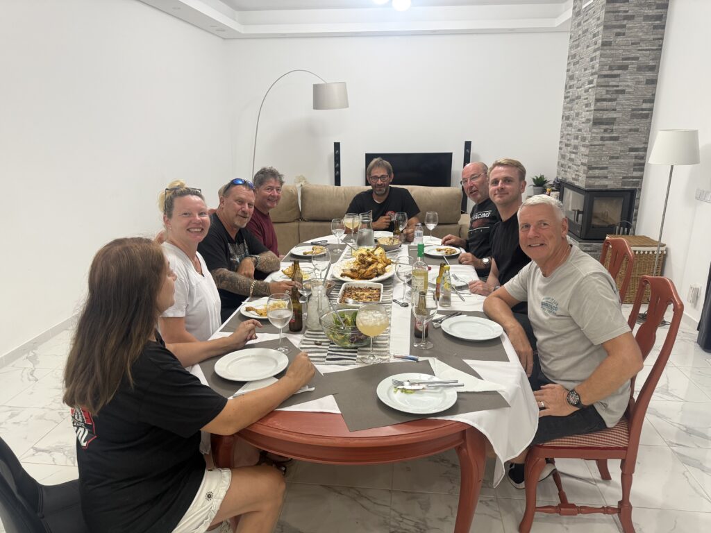 Guests sharing dinner around the table at the Lets Ride Portugal base